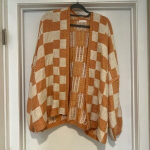 Cozy Peach and Cream Checkered Cardigan